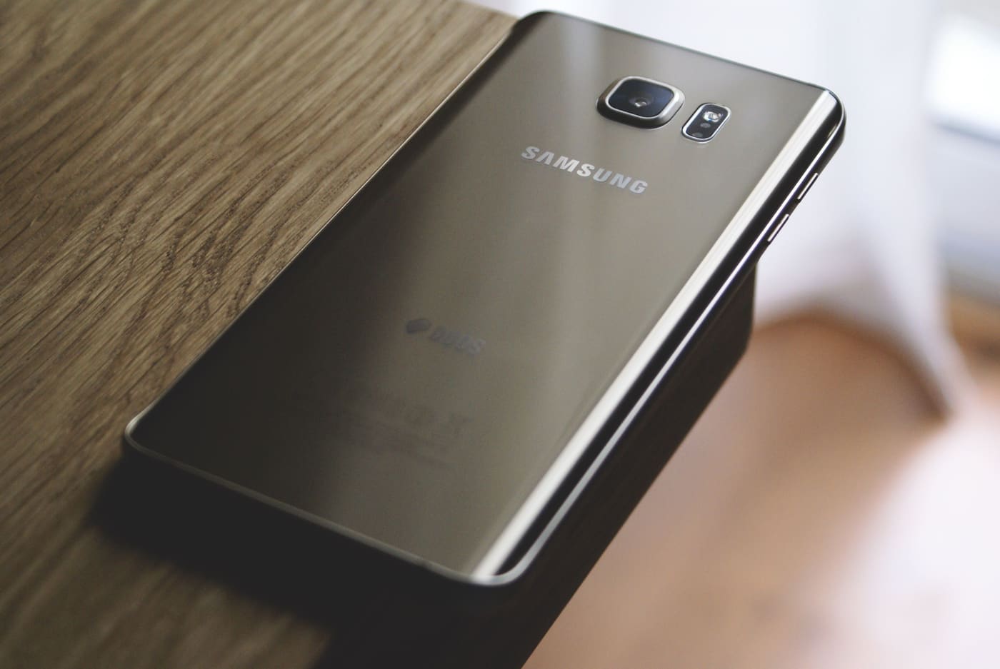 Close-up of a used Samsung smartphone camera module and housing